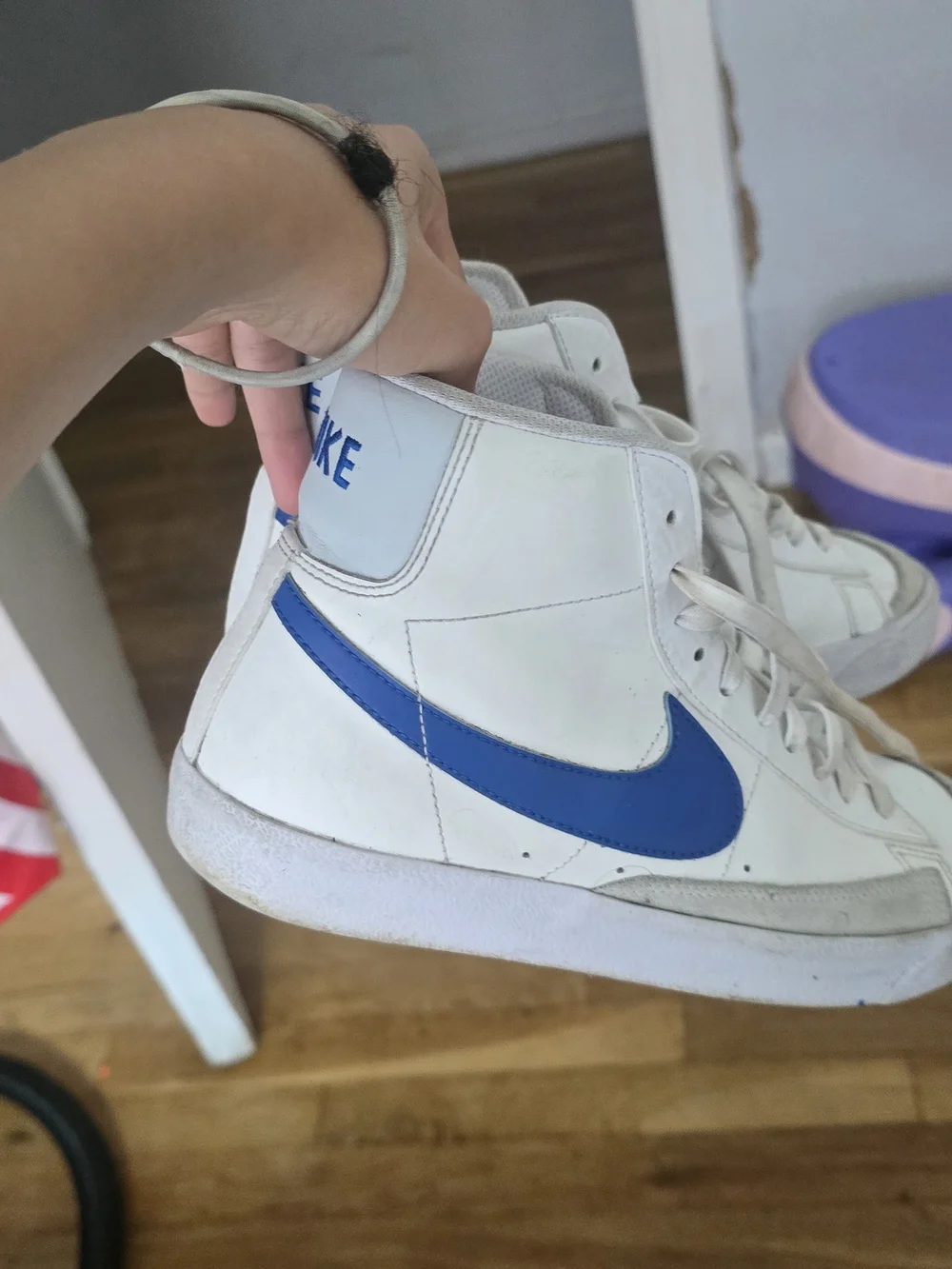 Nike White High-Top Sneakers with Blue Swoosh